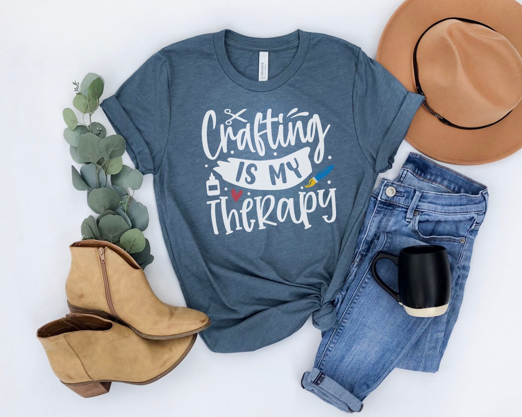 Crafting is My Therapy t-shirt in blue with jeans, hat, mug, and boots