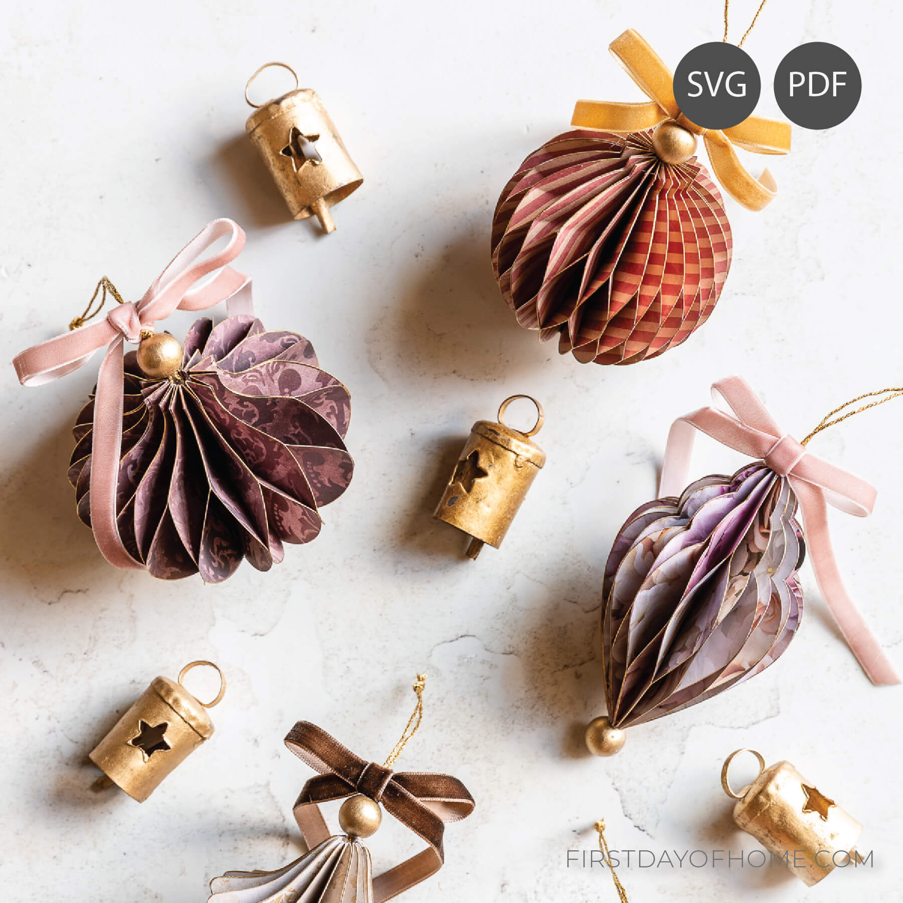 Decorative paper Christmas ornaments with ribbons and bells.